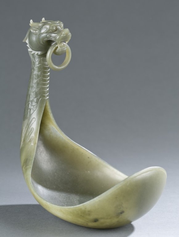 19th c. Qing Dynasty jade bowl: A 19th c. Qing Dynasty jade bowl with a dragon handle. Sticker on bottom Charlotte Horstmann & Gerald Godfrey Ltd. 9"h x 8"w. Originally purchased from Charlotte Horstmann & Gerald Godfrey, Ltd.