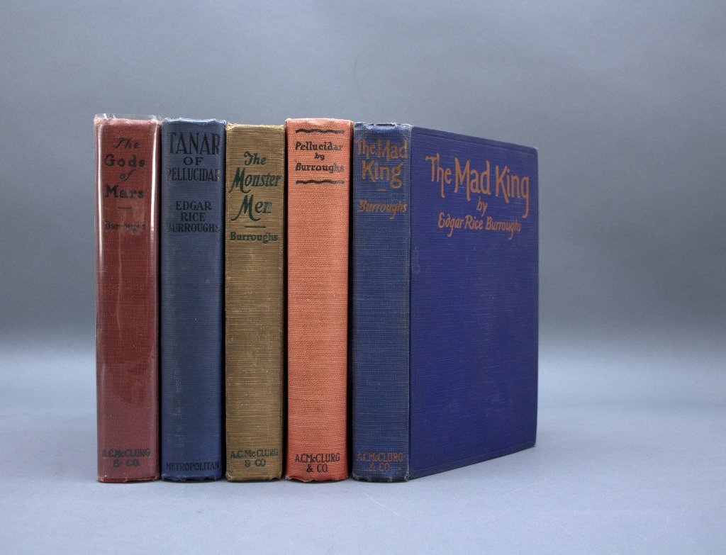 5 Burroughs 1sts: PELLUCIDAR, THE GODS OF MARS...: [Burroughs, Edgar Rice] 5 First Editions. 8vo. Cloth, very good, lacking djs.++ PELLUCIDAR. Chi: A. C. McClurg & Co., “1923” on title, “Published September, 1923” on c-page. 1st edition. Berge
