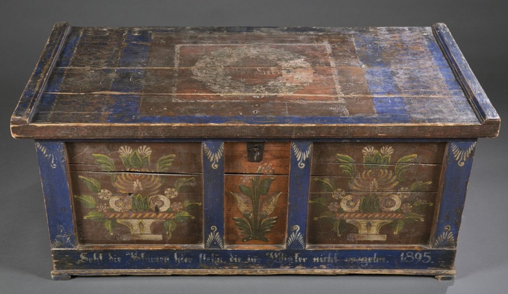 Painted German folk art blanket chest, c.1895.: A painted German folk art blanket chest, c.1895. Sometimes called immigrants chest. Made of solid pine painted with wreath and Mrs. Lieber on top, floral baskets on front, and a German phrase is paint