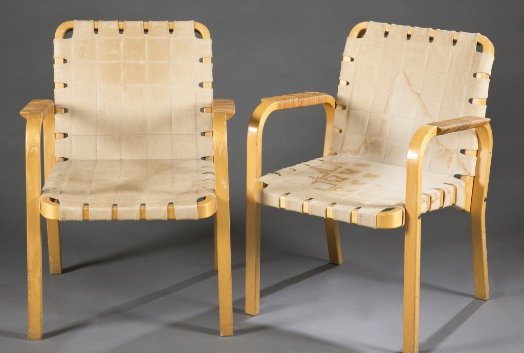 Group of 8 Alvar Aalto model 45 armchairs.: A group of 8 Alvar Aalto model 45 armchairs. 2nd half 20th century. Designed by Alvar Aalto in 1947 and produced by ARTEK in Finland. Laminated birch frame with rattan armrests and webbing for the sea