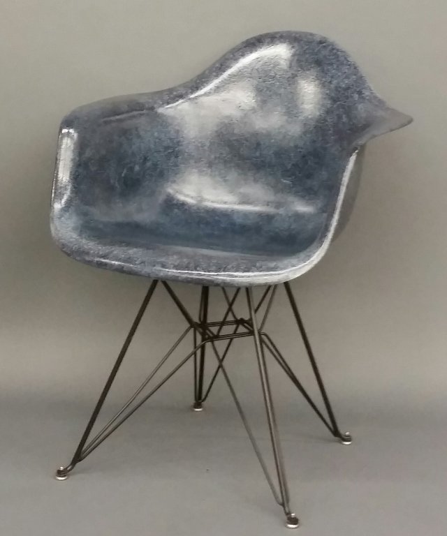 Eames Shell Armchair for Herman Miller.: Eames Shell Armchair for Herman Miller. Mid 20th century. Designed by Charles and Ray Eames for Herman Miller. Molded blue fiberglass shell with the Eiffel Tower base. On bottom, impressed with Herman