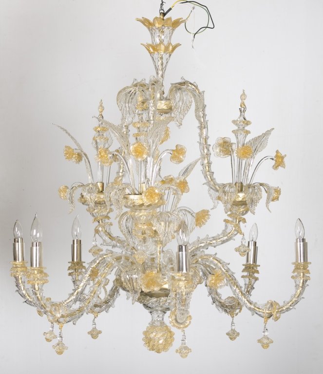 Clear and gold Murano glass chandelier.: An extravagant clear and gold Murano glass chandelier. Italian. 20th century. 2 tiers having leaves and floral stems. Approx. 34"h x 34"w.