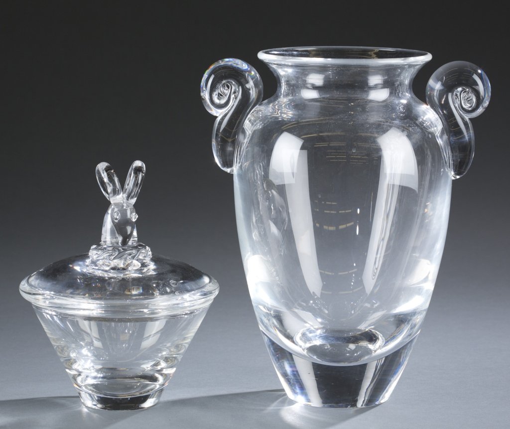 Steuben glass ram's head candy dish & urn vase.: A clear Steuben glass candy dish and vase. Second half 20th century. ++ Ram's head candy dish. 6 1/2"h x 5 1/2"w. ++ Urn shaped vase. Etched: Steuben. 9 1/2"h x 8"w.