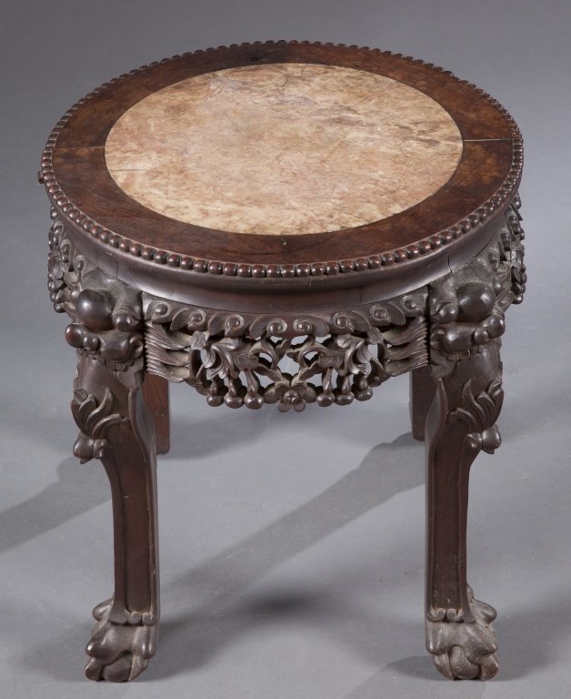 A Chinese rosewood and marble taboret.: A Chinese rosewood and marble taboret. 19th century. Carved rosewood with fretwork and floral design with a pink and tan marble inset top. Signed on the underside of the table top. 17 3/4"h; base: 14 