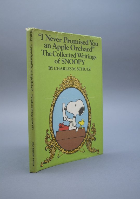 "I Never Promised You an Apple Orchard" 1st ed.: [Schulz, Charles M./Children's]. “I NEVER PROMISED YOU AN APPLE ORCHARD” THE COLLECTED WRRITINGS OF SNOOPY. Holt, Rinehart and Winston, 1976, (“75-“ LCCN). 1st edition. Thin 12mo. Illustrated 