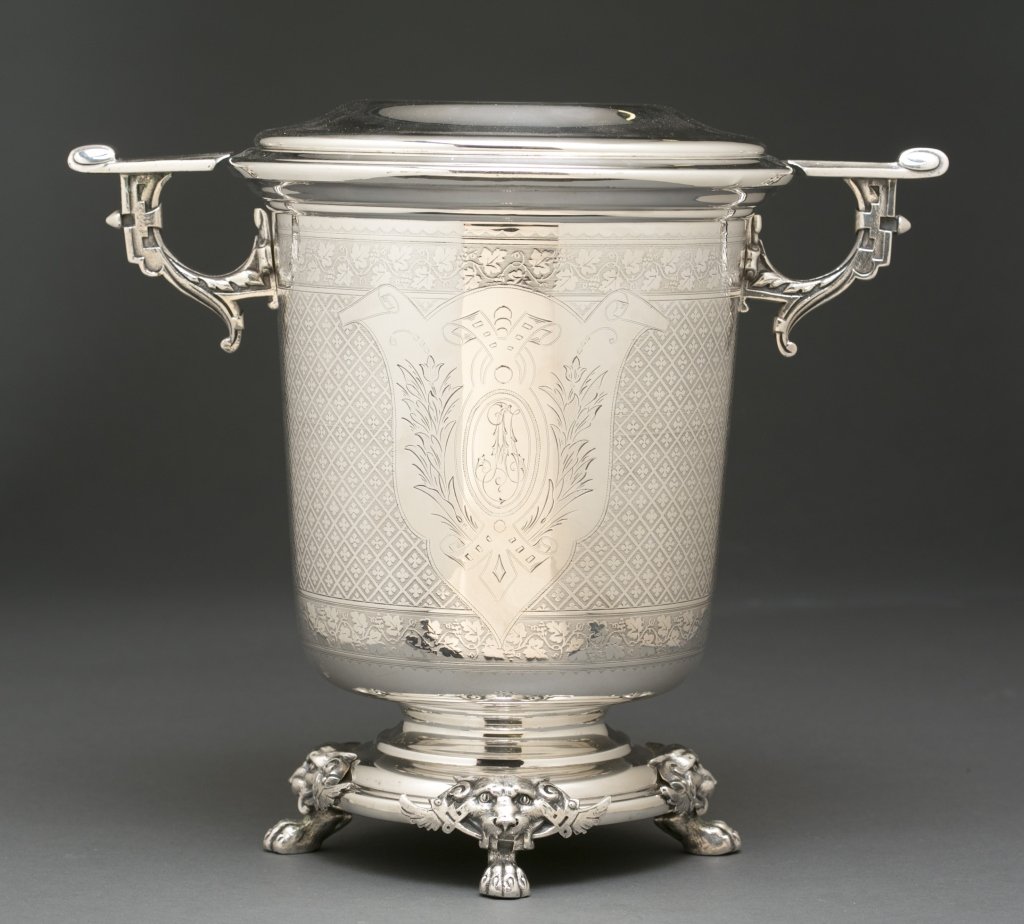 Norblin wine cooler, 1872-1893.: A Norblin & Co. (1872-18393) wine cooler with metal inserts. The decoration is a pastiche of revival styles and includes a heraldic shield, floral bands, a large patterned band of a quatrefoil in a lo
