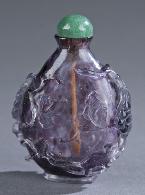 A Chinese purple glass snuff bottle. (1 of 7)