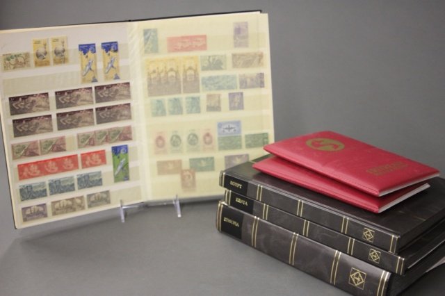 6 East African stamp albums, 20th century. (1 of 2)