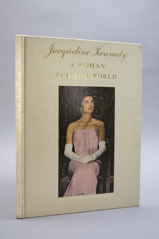 Signed, inscr by Jacqueline Kennedy to Sally West.: [Kennedy, Jacqueline/ Inscribed] Robert T. Harding and A. L. Holmes. JACQUELINE KENNEDY: A WOMAN FOR THE WORLD. Encyclopedia Enterprises/ Vanguard Press, (1966). Ffep signed and inscribed “For Sally