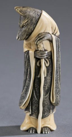 A Japanese ivory netsuke of Inugami. (1 of 5)