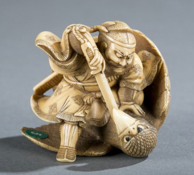 A Japanese ivory netsuke of Shoki. (1 of 5)