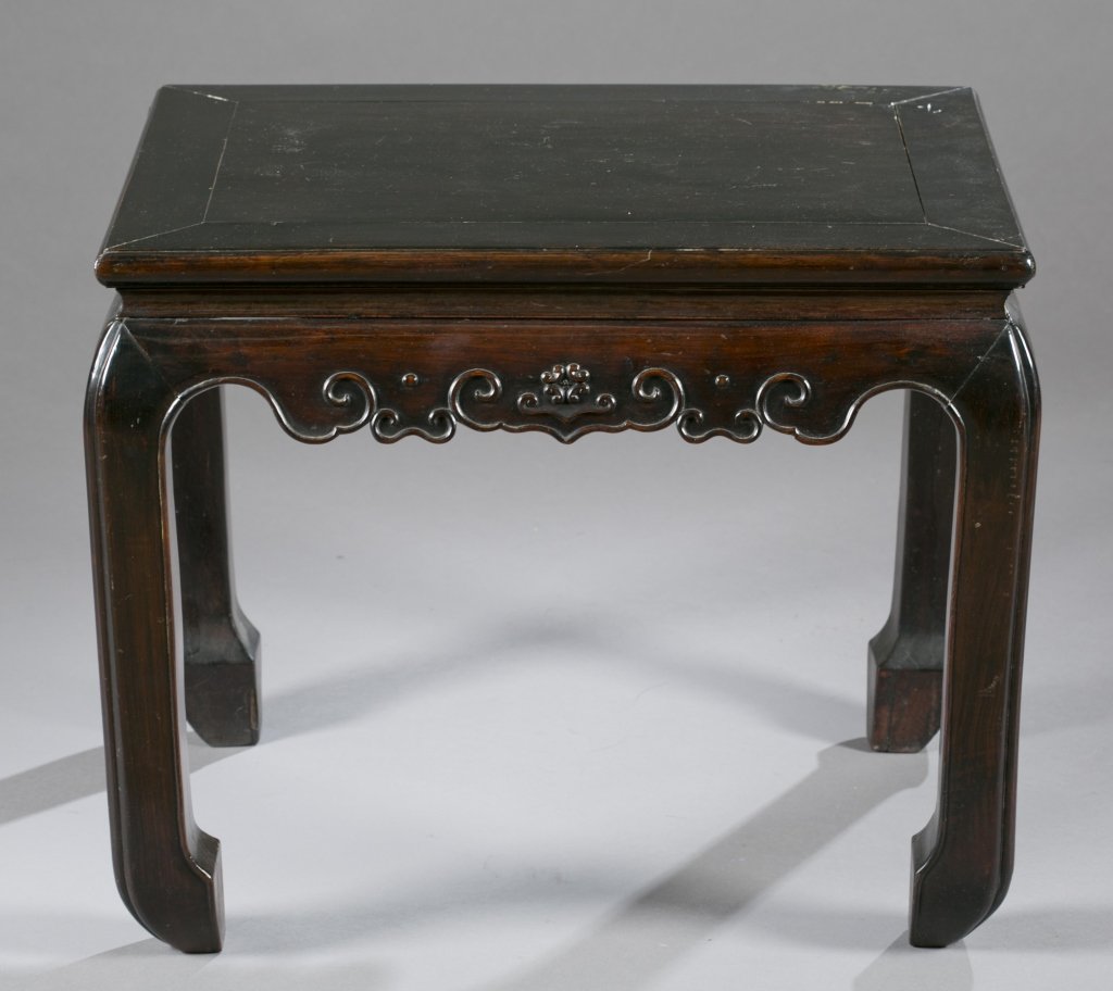 A Chinese hardwood low side table. (1 of 2)