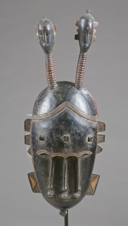 A face mask with multiple faces. 20th c. (1 of 4)