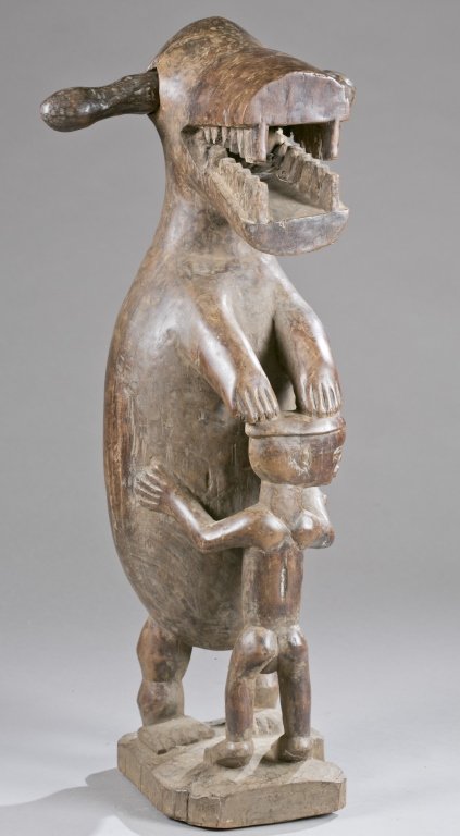 A standing animal figure with a baby. 20th c. (1 of 6)