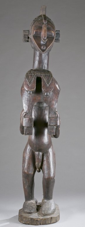 A standing figure with Nimba mask. 20th c. (1 of 4)