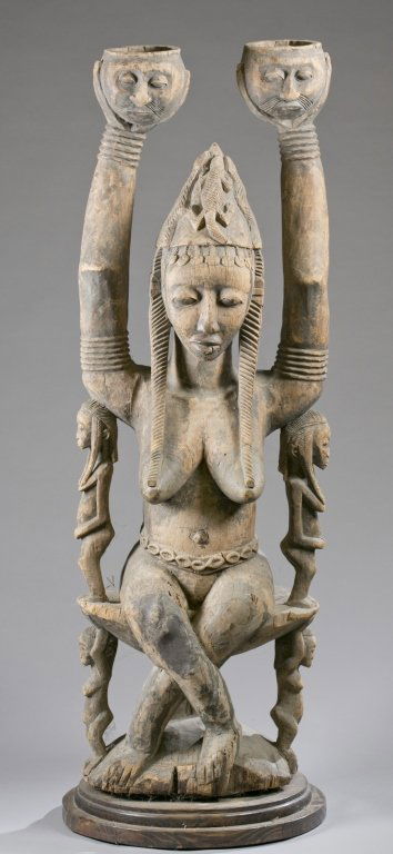 A seated female figure. 20th c. (1 of 4)
