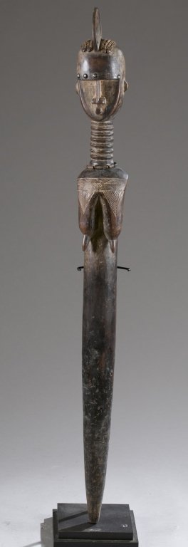 Carved staff w/ head finial. 20th c. (1 of 5)