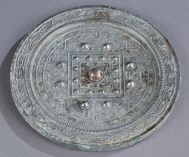 Asian silvered bronze mirror. (1 of 4)