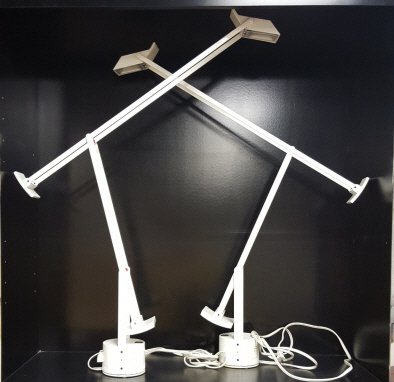 Pair of white Artemide "Tizo" desk lamps.: A pair of white Artemide "Tizo" lamps by Richard Sapper. Made in Italy. Fully raised: 45"h. Fully horizontal: 42"w.The property of The Honorable Thomas S. Foley, former Speaker of the House of Represe