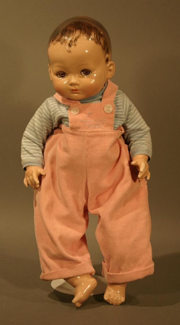 Effanbee composition baby doll with side glance ey: Effanbee composition baby doll with side glance eyes. Good condition, some crazing. 50's Clothes, marked "Effanbee Made in USA" on back of head. 20" tall