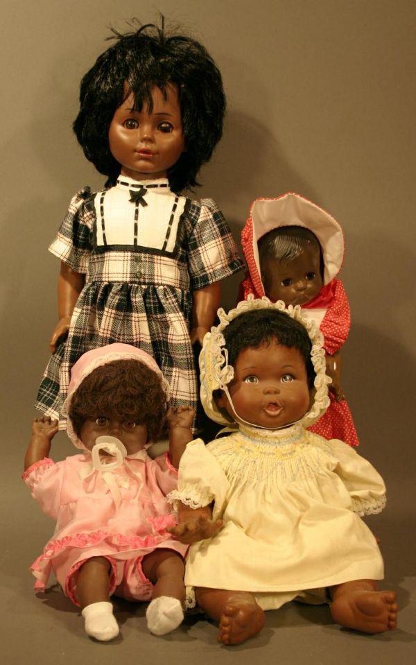 Effanbee Black Doll in Red Dress, and five other b: Effanbee Black Doll in Red Dress, and five other black dolls.
