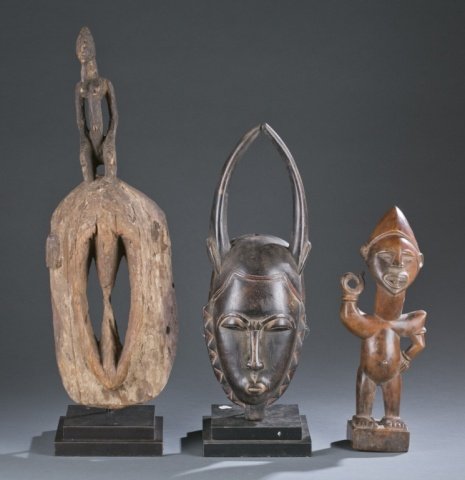 Group of 2 masks and a figure. (1 of 6)