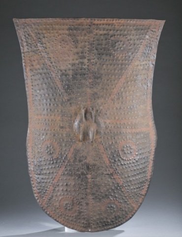Metal shield, Kirdi. c.20th century.: A metal shield. Nigeria/Cameroon, Kirdi. c.20th century. 34". In most cases the date is a 20th century attribution is an indication of stylistic origin and not a exact date of creation. Unless stated 