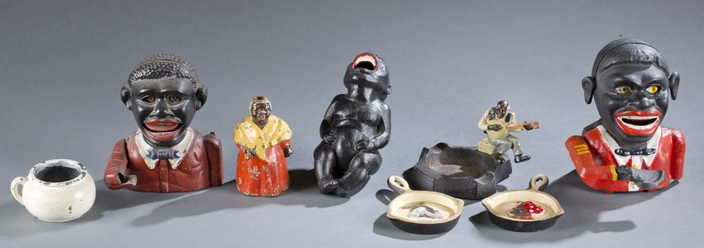 7 Items: Toys with Black Themes, Some Racist.: [Toys/Various] 7 Items. ++ 2 Little Joe cast iron mechanical banks. 1 has a missing hand, very good, Paint loss, minor wear. ++ Cast Iron Boy Going To Toilet On Chamber Pot. VG, little surface chippin