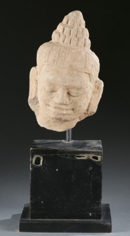 Southeast Asian stone head of a temple guard. (1 of 4)