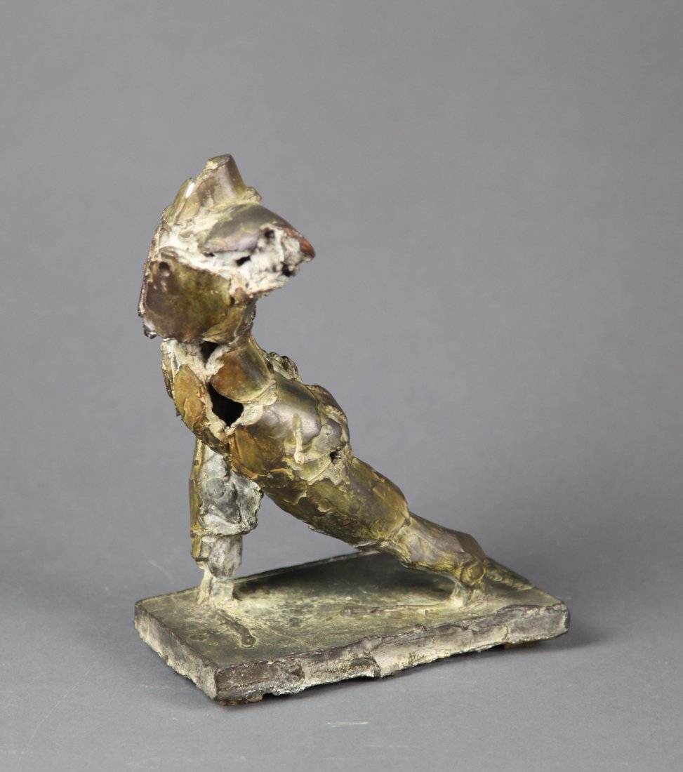 Howard Newman, Modern metal sculpture of a lunging body (1 of 4)