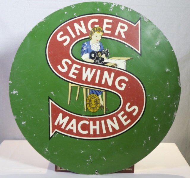 Singer Sewing Machines sign.: A Singer Sewing Machines enamel sign. In fair condition with wear. 24" diam.Condition: paint loss spots throughout