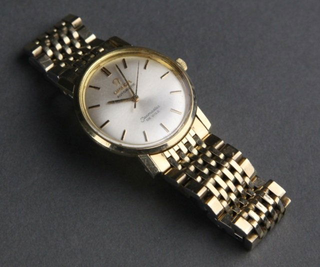 Omega, 14k yellow gold case wrist watch w/ band. (1 of 4)