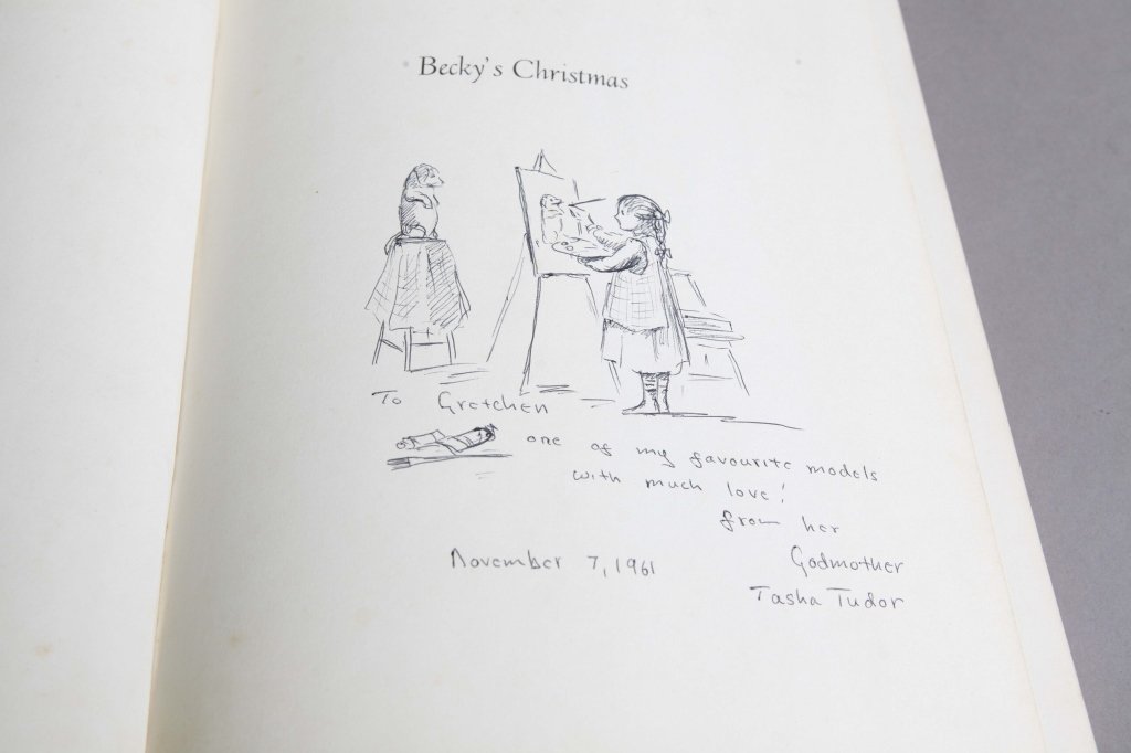 Tasha Tudor. BECKY’S CHRISTMAS. Sgd, orig drawing.: [Tudor, Tasha/Sgd. w/ Drawing] Tasha Tudor. BECKY’S CHRISTMAS. Viking Press, (1961). 1st edition. Hare B13. Original ink drawing of a girl painting a picture of a dog standing on his hind legs a sto