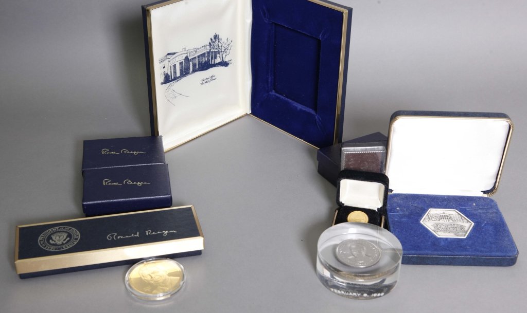Reagan WH Cufflinks, Bill Sign Pens & Coins: [Reagan] 27 Items. Mostly near fine.++ 2 Ronald Reagan bill signing pens (1 in orig box).++ 3 pairs of Ronald Reagan cuff links in original 3 x 2 ¼ x 7/8 inch boxes (not wrapped). The cufflinks have