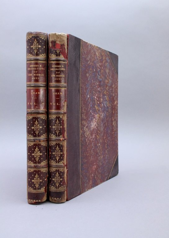 Shaw DRESSES AND DECORATIONS... 2 Vols. 95 plates: [Costume/English Royalty] Henry Shaw. DRESSES AND DECORATIONS OF THE MIDDLE AGES. 2 Vols. Lon: William Pickering, 1843. 95 plates. (Numbered to 94 on plate lists. Vol II’s litho title not listed). M