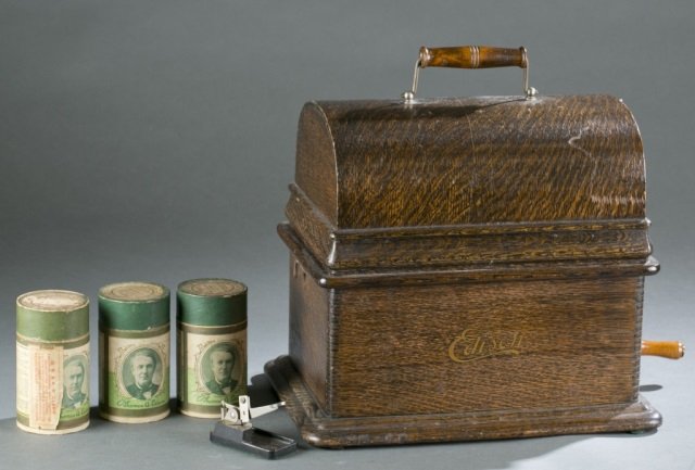 Edison cylinder phonograph.: An Edison cylinder phonograph with 3 cylinder rolls. 11"h x 12 1/2"w x 9"d.