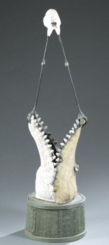 Todd Warner Crocodile & heron sculpture, 20th c.: Warner, Todd (United States, 1945-). Crocodile head & heron on wooden basket half sculpture. 1989. Mixed media--paint, wood, ceramic, and metal. Signed and dated. Approx. 55 3/8"h x 16"w.