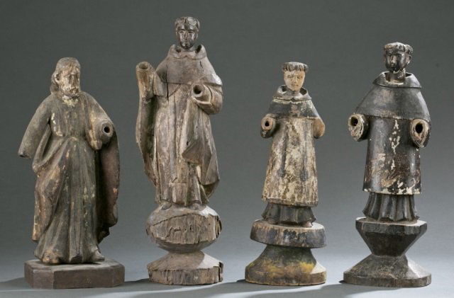 Group of 4 polychrome carved wood Santos figures.: A group of 4 polychrome carved wood Santos figures. ++ (3) Saint Francis. ++ Male Saint in robes of red, white, and green. Largest: 13 1/4"h x 4 1/4"w x 2 3/4"d. Condition: Missing hands on all figure