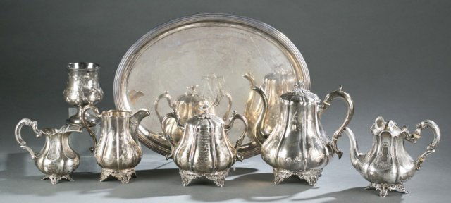 Victorian Revival style tea set w/ tray. 1845-1856: A Victorian revival style tea set with tray. ++ 3 pieces of Stebbins & Co. c.1845-1856. A teapot, sugar bowl and creamer. ++ Cup with foot, A Cutter. (coin silver). 5". ++ Netherlands small teapot (6