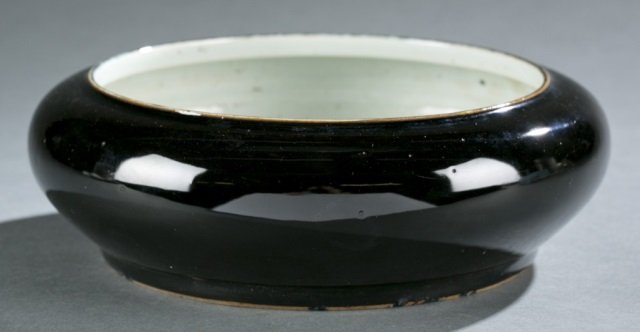 Chinese dark glaze brush washer.: A Chinese dark glaze brush washer. Late Qing dynasty, after Kangxi style. Dark glaze with golden spots under light. No mark on the bottom. 3"h x 8 3/4"dia.