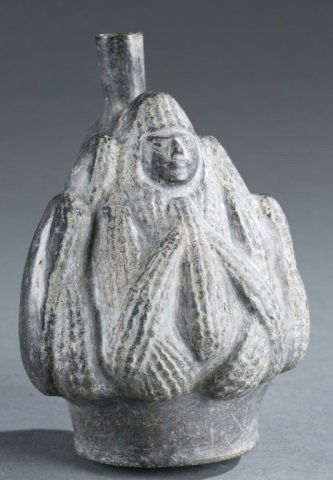 Chimu style ceramic stirrup vessel. c.20th century: A Chimu style ceramic stirrup vessel in the shape of a ma. North Coast Peru. c.20th century. 6 3/4"h x 5 1/4"w x 5 1/2"d. Please note that unless stated stands do not come with pieces.