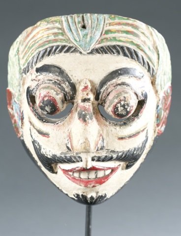Polychrome face mask. Indonesia. c.20th cen.: A polychrome wooden face mask. Indonesia. c. 20th century. 8"h. Please note that unless stated stands do not come with pieces.