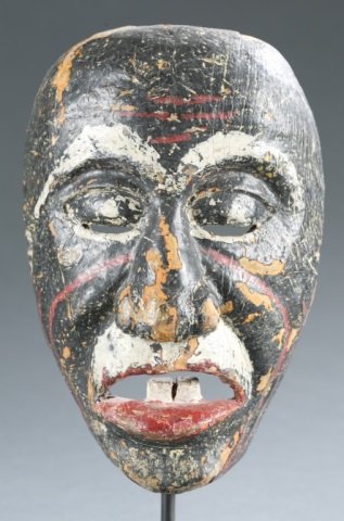 Indonesia polychrome face mask. c.20th cen.: A polychrome face mask, Indonesia c. 20th century. 8 1/2"h. Please note that unless stated stands do not come with pieces.
