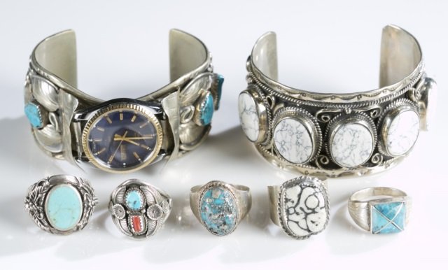Group of Sterling Native American jewlery.: Large lot of sterling silver Native American jewelry. The lot consists of two gemset bangles (one is a watch band for a Timex ), eleven gemset rings. Most of the jewelry is signed. Weight 358.10 grams