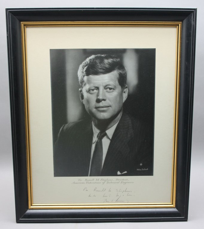 John F. Kennedy photograph.: [President Kennedy, John F.] Photograph. Inscription below image is likely secretarial (“For Russell M. Stephens – With best wishes – John F Kennedy”). Stephens was President of the American F