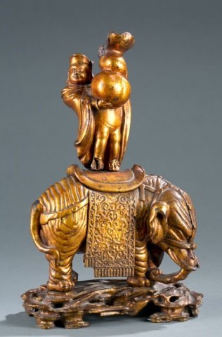 Chinese gilt wood figure of merchant on elephant. (1 of 8)