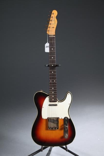 A Fender Telecaster sunburst electric guitar.: A Fender Telecaster sunburst electric guitar.