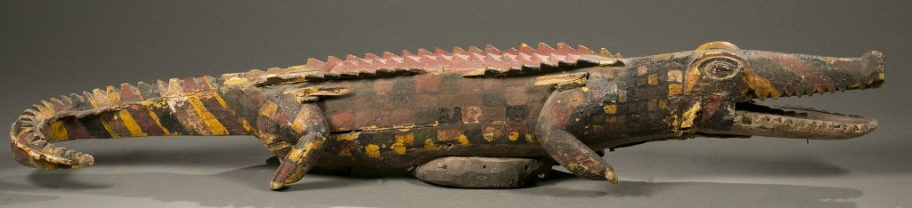 Ijo crocodile water spirit headdress.: A crocodile water spirit crest headdress. Nigeria, Ijo. 20th century. 10"h x 65"w x 13"d. Provenance: Inventory and Collection from the Estate of Merton D. Simpson.