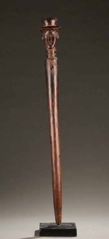 Kuba coplext staff, 20th century.: A staff with male head wearing a hat a top. Democratic Republic of the Congo, Kuba complex. 20th century. 24 1/4"l. Provenance: Inventory and Collection from the Estate of Merton D. Simpson.