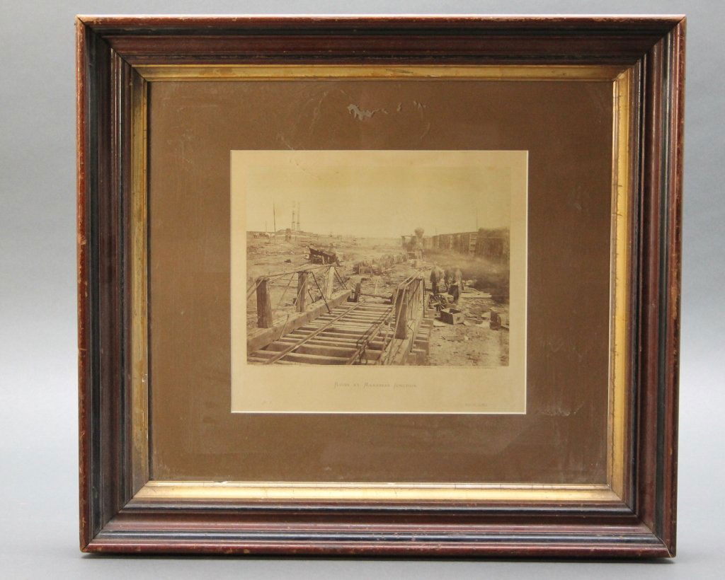 Gardner Albumen Photo from INCIDENTS OF THE WAR.: [Gardner, Alexander/Civil War] Alexander Gardner Albumen Photograph: "Incidents of the War. Ruins at Manassas Junction." The photograph shows men looking over the remains of a turntable where the Oran